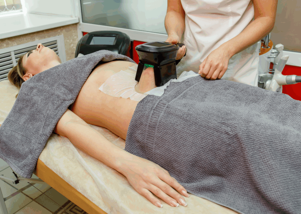 A tattoo removal session in progress, featuring a person applying a laser to their skin.