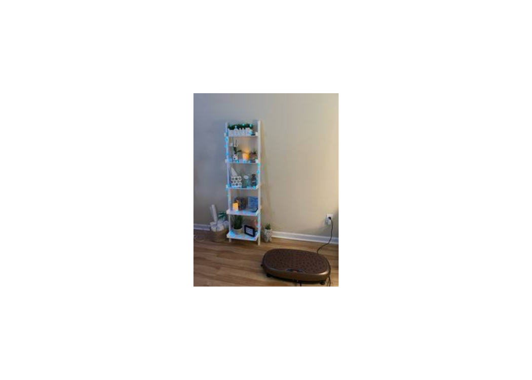 A shelf displaying several books in a cozy room setting.
